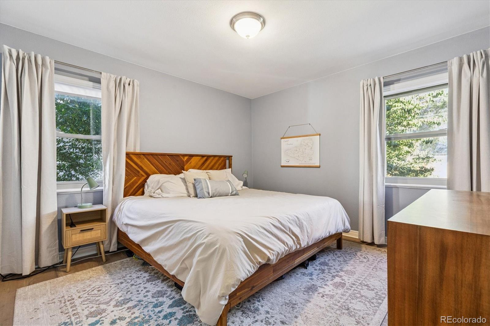 2660 Kearney Street Denver, CO 80207 - Photo 16 of 35 a bedroom with a bed and a window