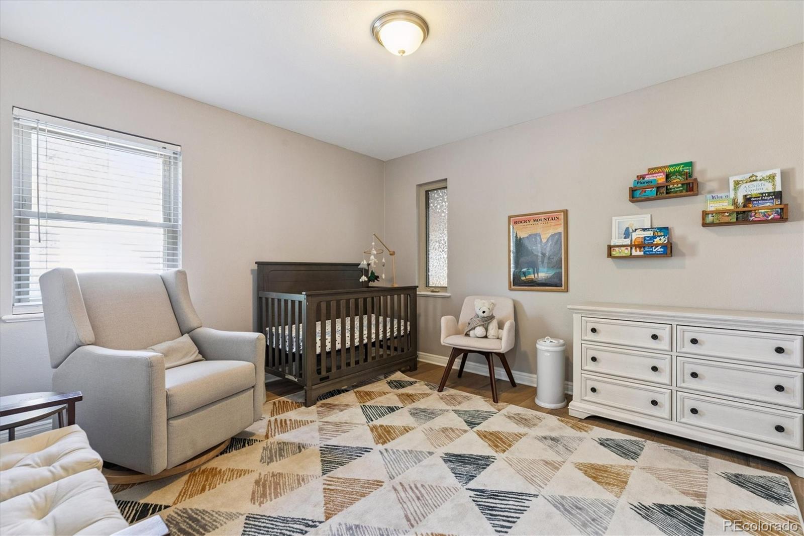 2660 Kearney Street Denver, CO 80207 - Photo 17 of 35 a bedroom with furniture and a window