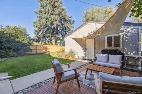 a outdoor living space with furniture and garden view