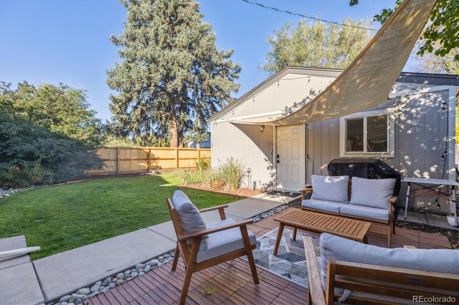 2660 Kearney Street Denver, CO 80207 - Photo 26 of 35 a outdoor living space with furniture and garden view
