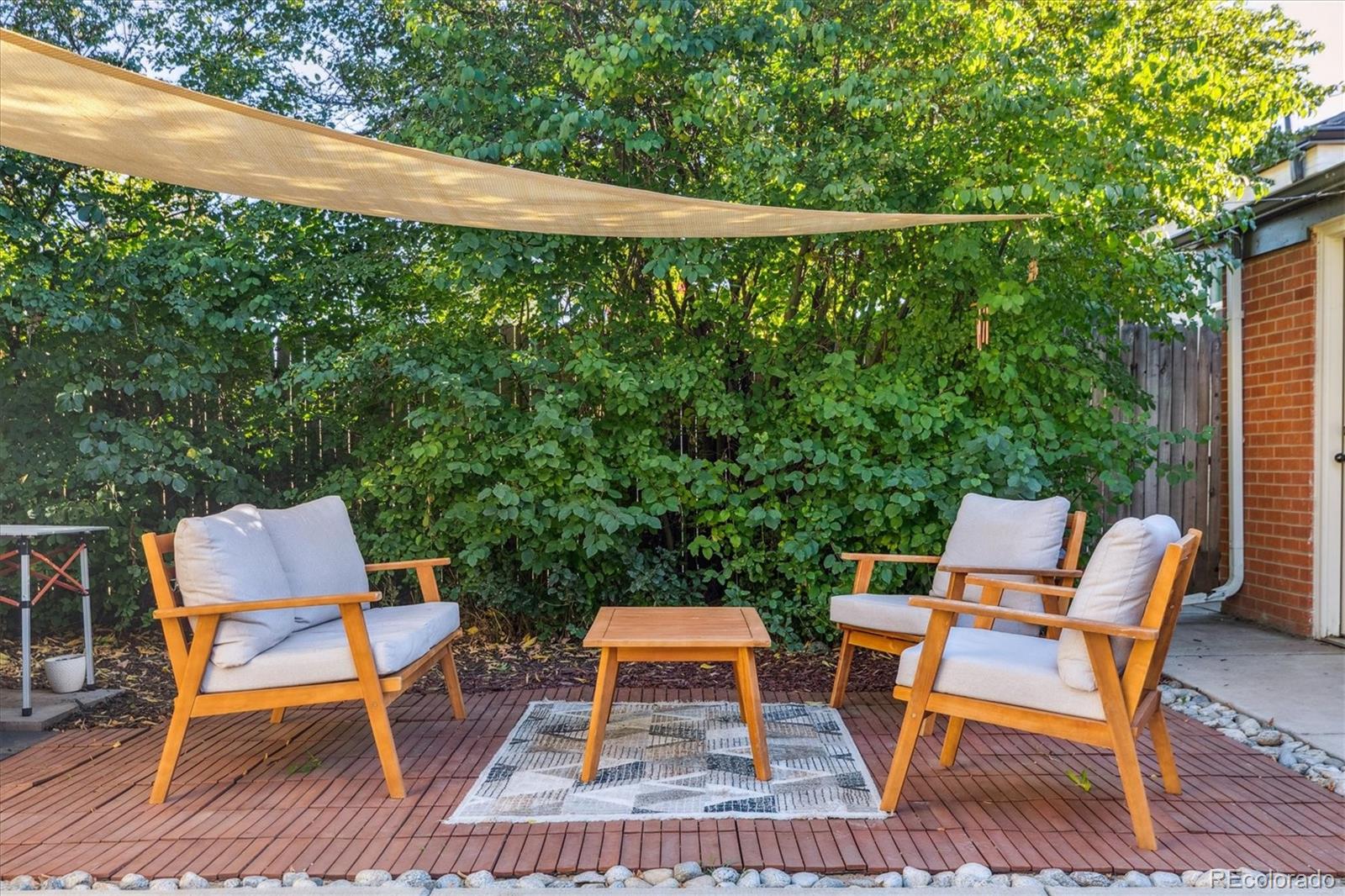 2660 Kearney Street Denver, CO 80207 - Photo 27 of 35 a backyard of a house with wooden floor yard outdoor seating and yard in the back