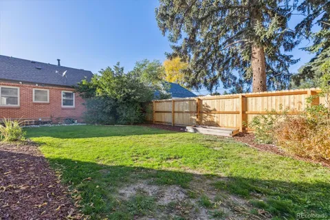a backyard of a house with lots of green space