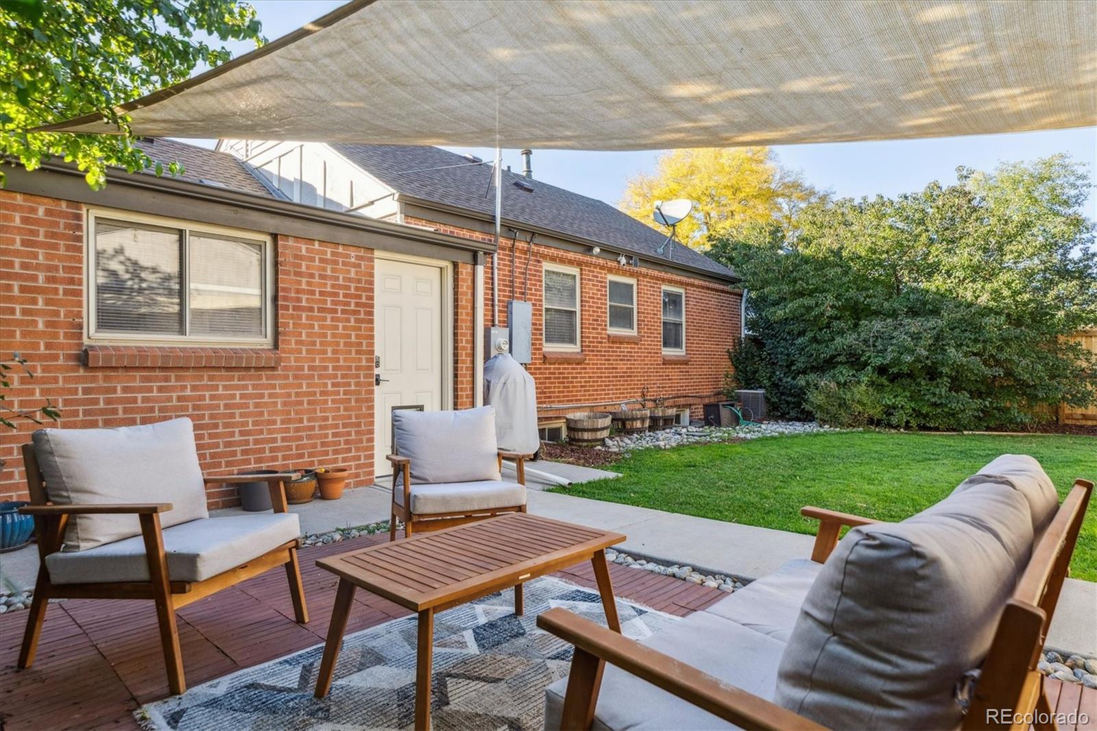 2660 Kearney Street Denver, CO 80207 - Photo 32 of 35 a backyard of a house with table and chairs
