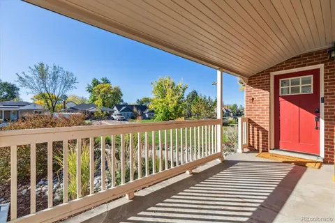 a view of a balcony with furniture