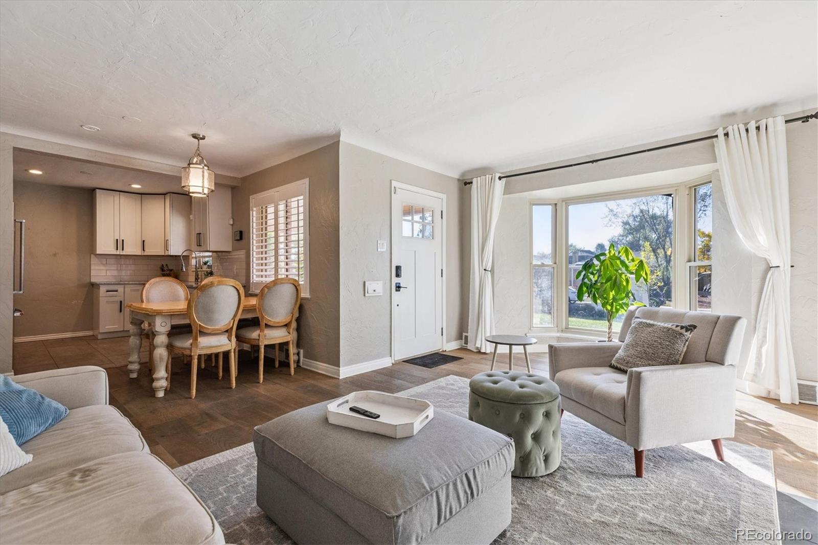 2660 Kearney Street Denver, CO 80207 - Photo 6 of 35 a living room with furniture and a large window