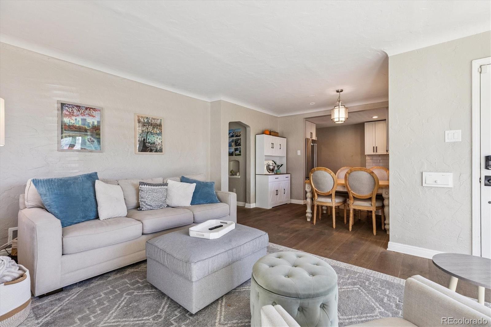 2660 Kearney Street Denver, CO 80207 - Photo 9 of 35 a living room with furniture and a table