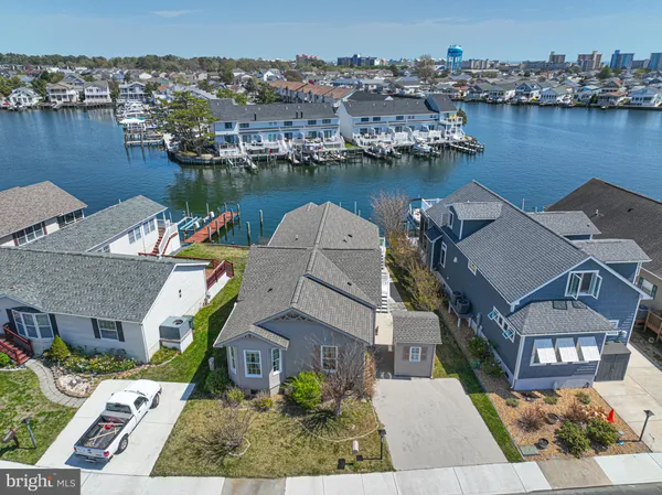 an aerial view of a house with a lake view