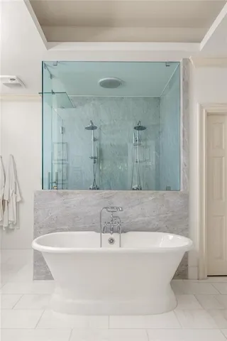 a view of a chair and tables in the patio