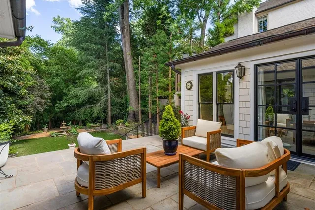 a outdoor space with patio the couches and a dining table with the garden view