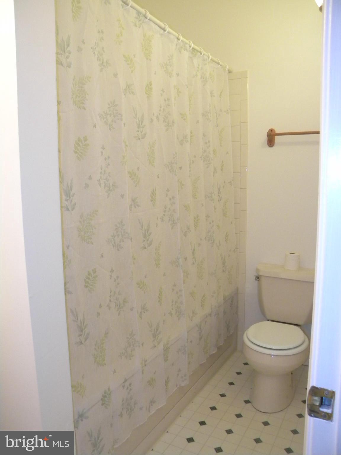 818 Ridge Court Lusby, MD 20657 - Photo 13 of 18 a bathroom with a toilet and a shower