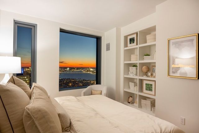 a bedroom with a bed and a cabinets