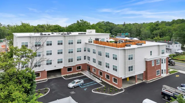 a view of a tall building with a ocean view
