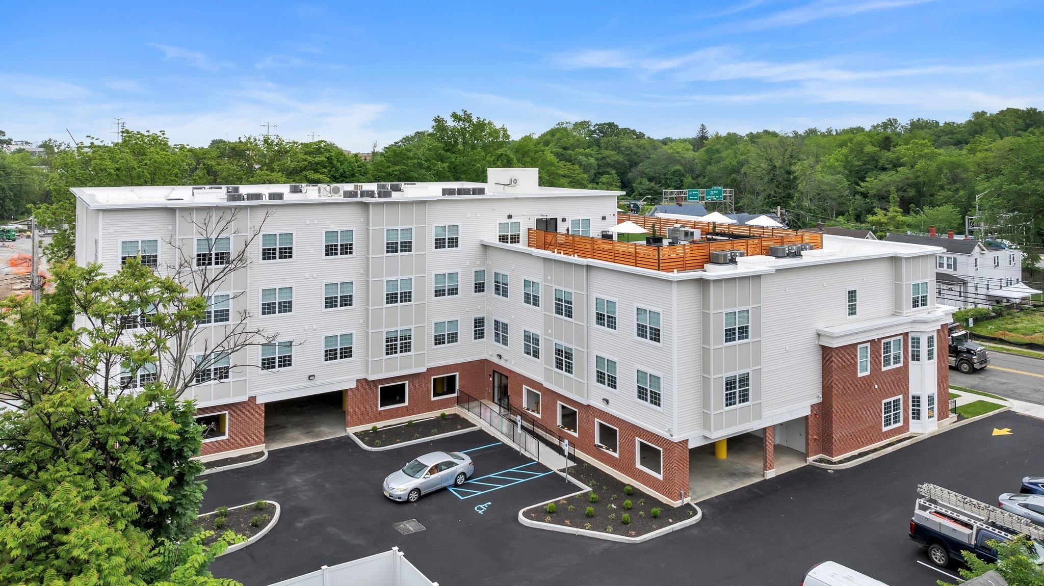 a view of a tall building with a ocean view