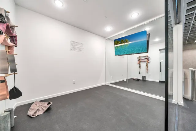 an empty room with a bench