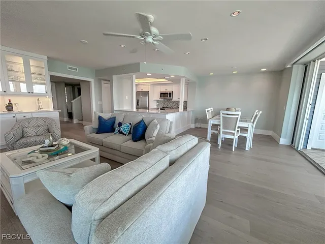 a view of a dining room with furniture and wooden floor