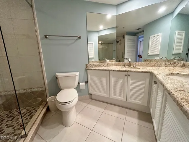 a view of a hallway with wooden floor and furniture