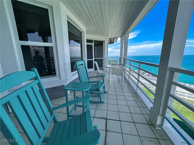 a spacious bedroom with a large bed and a large window