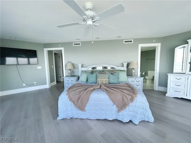 a bedroom with bed and a window