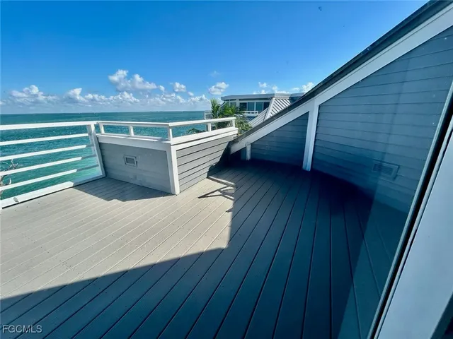 a view of outdoor space with wooden floor and fence