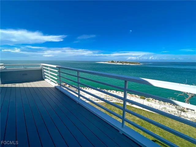 a view of an ocean and a yard