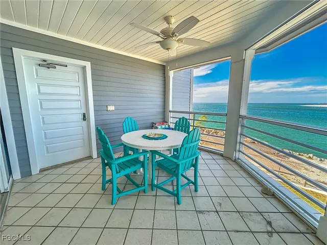 a view of a room with furniture and windows