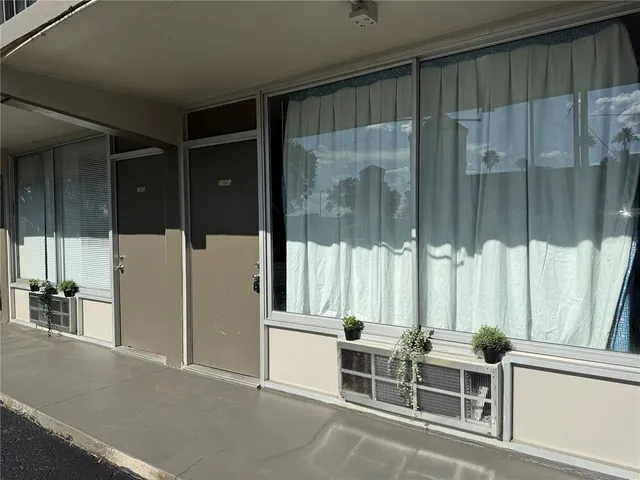 a view of a balcony with table and chairs