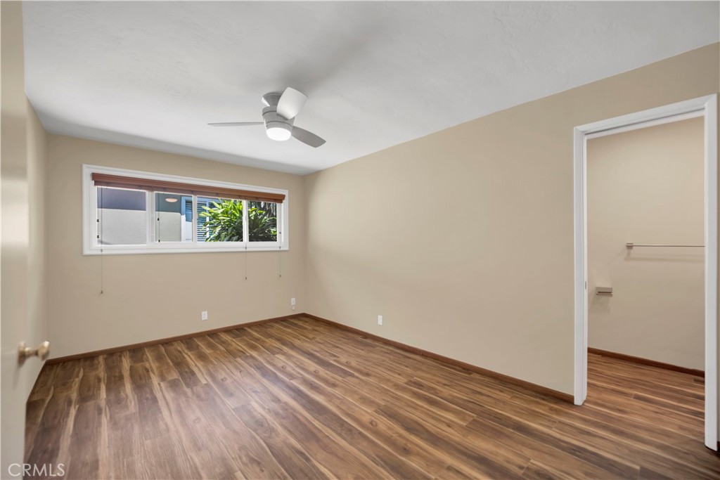 2214 2nd Street, Unit 6 Long Beach, CA 90803 - Photo 11 of 22 a view of an empty room with wooden floor and a window