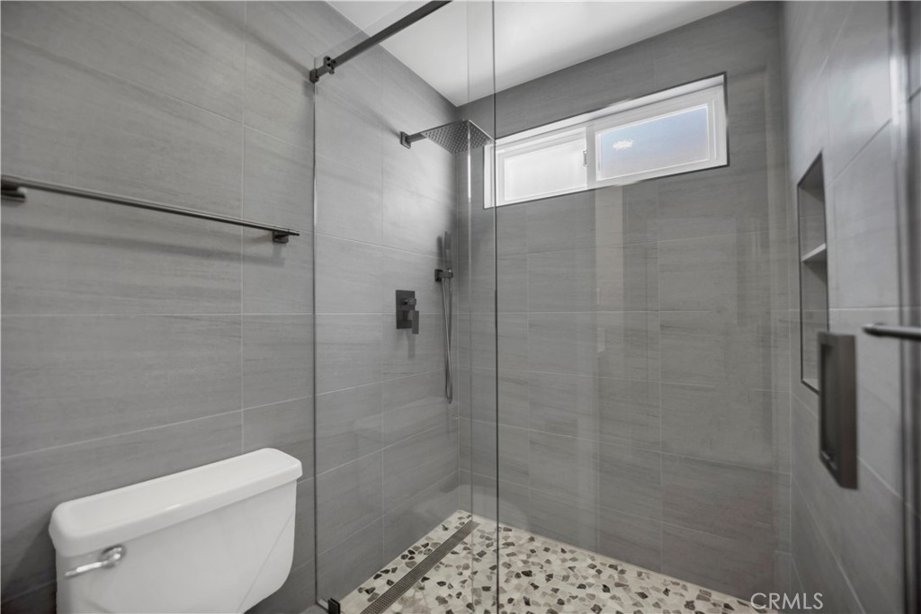 2214 2nd Street, Unit 6 Long Beach, CA 90803 - Photo 17 of 22 a bathroom with a shower and toilet
