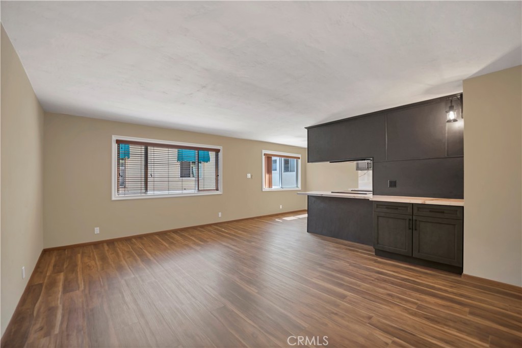 2214 2nd Street, Unit 6 Long Beach, CA 90803 - Photo 8 of 22 a living room with hard wood floors and a wooden floor