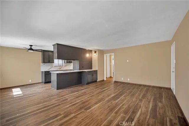 a view of kitchen and wooden floor