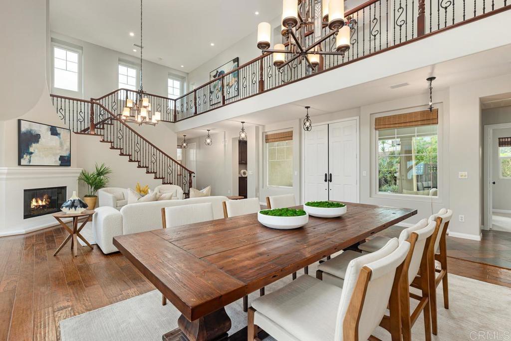 7627 Circulo Sequoia Carlsbad, CA 92009 - Photo 11 of 72 a view of a dining room with furniture and wooden floor