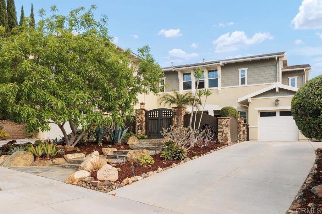 7627 Circulo Sequoia Carlsbad, CA 92009 - Photo 2 of 72 a patio with table and chairs and potted plants