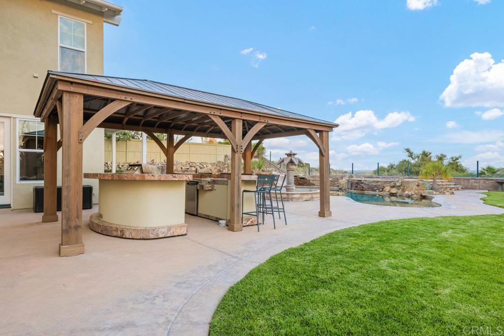 7627 Circulo Sequoia Carlsbad, CA 92009 - Photo 21 of 72 a view of a porch and garden