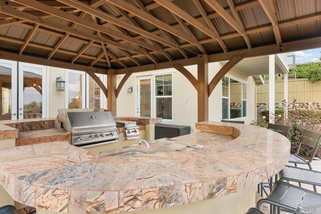 7627 Circulo Sequoia Carlsbad, CA 92009 - Photo 22 of 72 a spacious bedroom with a bed a large window with the outer view