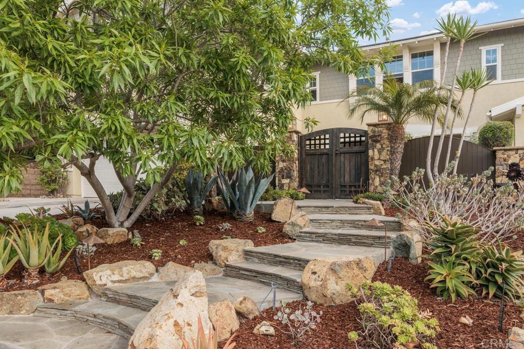7627 Circulo Sequoia Carlsbad, CA 92009 - Photo 3 of 72 a front view of a house with a yard