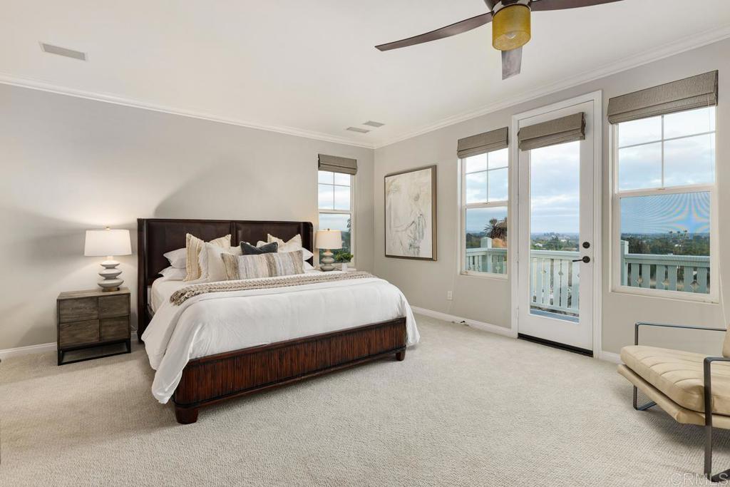 7627 Circulo Sequoia Carlsbad, CA 92009 - Photo 36 of 72 a spacious bedroom with a bed and a night stand