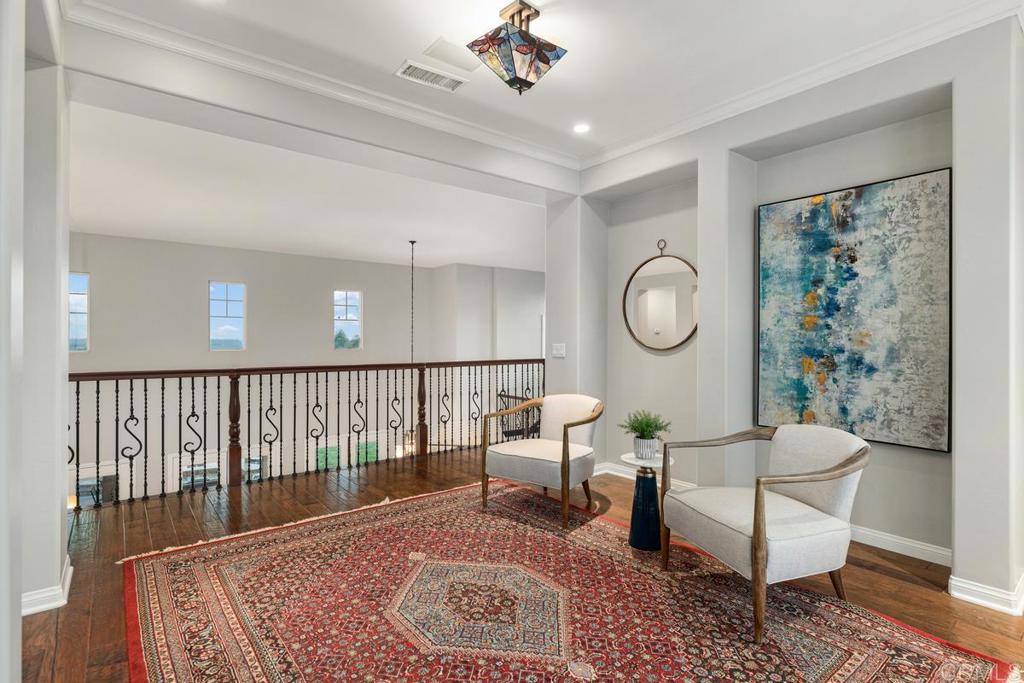 7627 Circulo Sequoia Carlsbad, CA 92009 - Photo 47 of 72 a living room with furniture a rug and a window