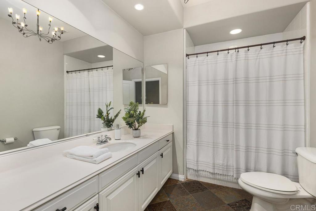 7627 Circulo Sequoia Carlsbad, CA 92009 - Photo 49 of 72 a bathroom with a sink toilet and shower