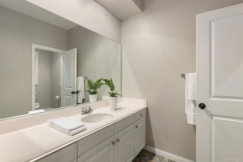 7627 Circulo Sequoia Carlsbad, CA 92009 - Photo 53 of 72 a bathroom with a sink and a mirror