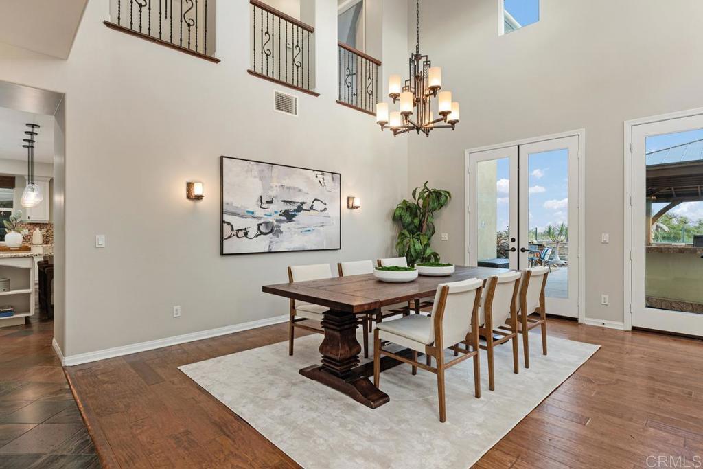 7627 Circulo Sequoia Carlsbad, CA 92009 - Photo 10 of 72 a view of a dining room with furniture window and wooden floor