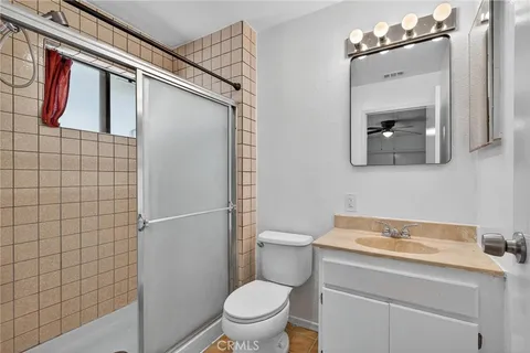 a bathroom with a toilet and a shower