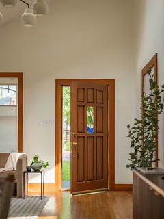 a view of a livingroom with furniture and front door