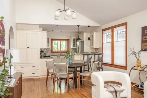 a view of a dining room with furniture window and outside view