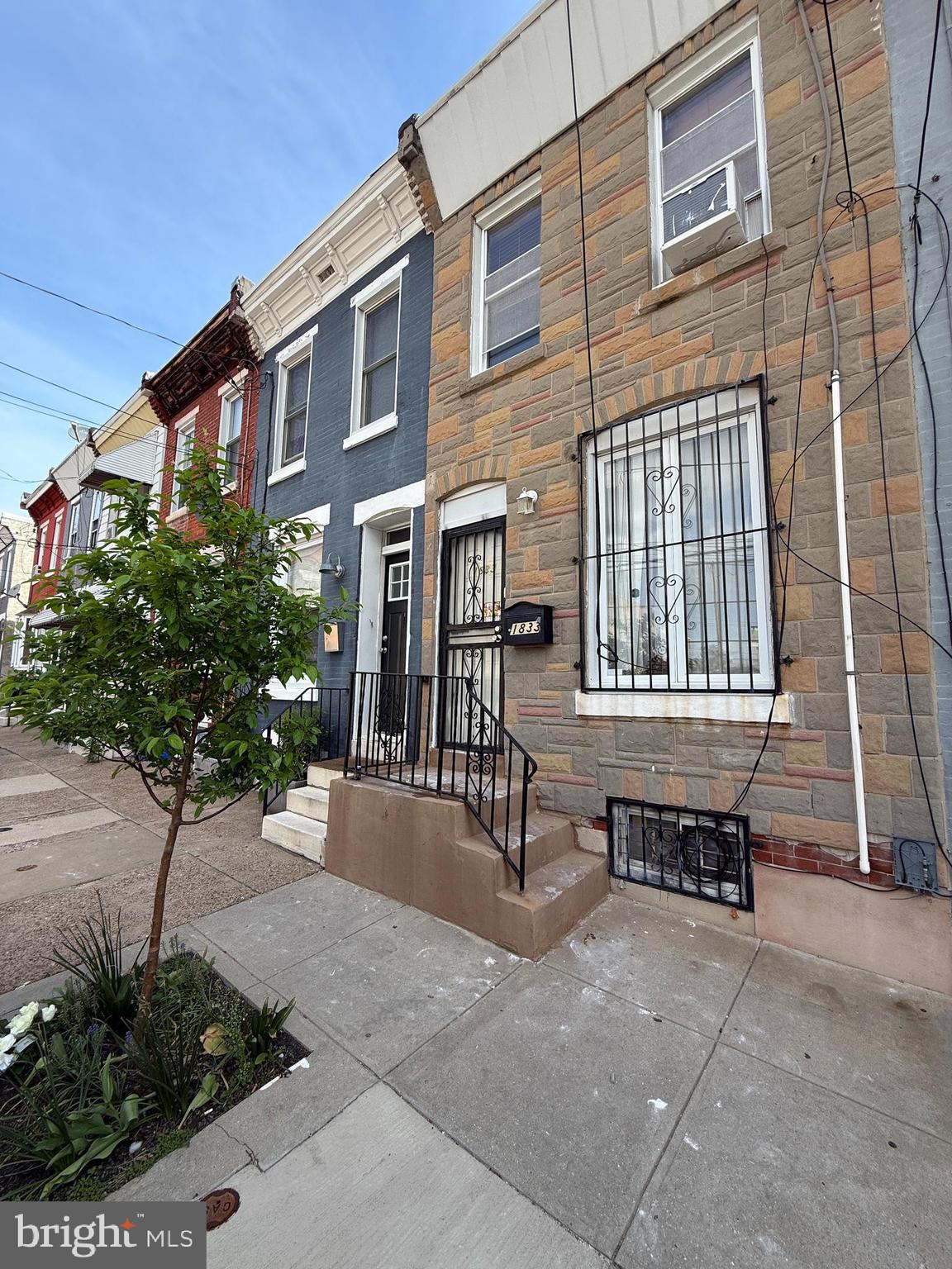 1833 East Harold Street Philadelphia, PA 19125 - Photo 1 of 9 a view of a building with a bench