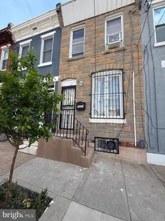 a view of a brick building with a bench and bench