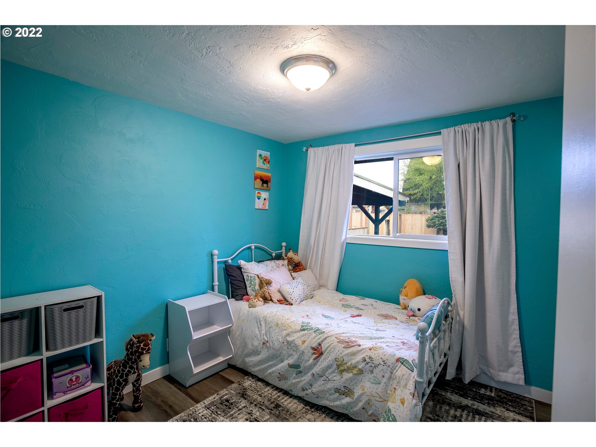 450 South 39th Place Springfield, OR 97478 - Photo 14 of 28 a bedroom with a bed and a window