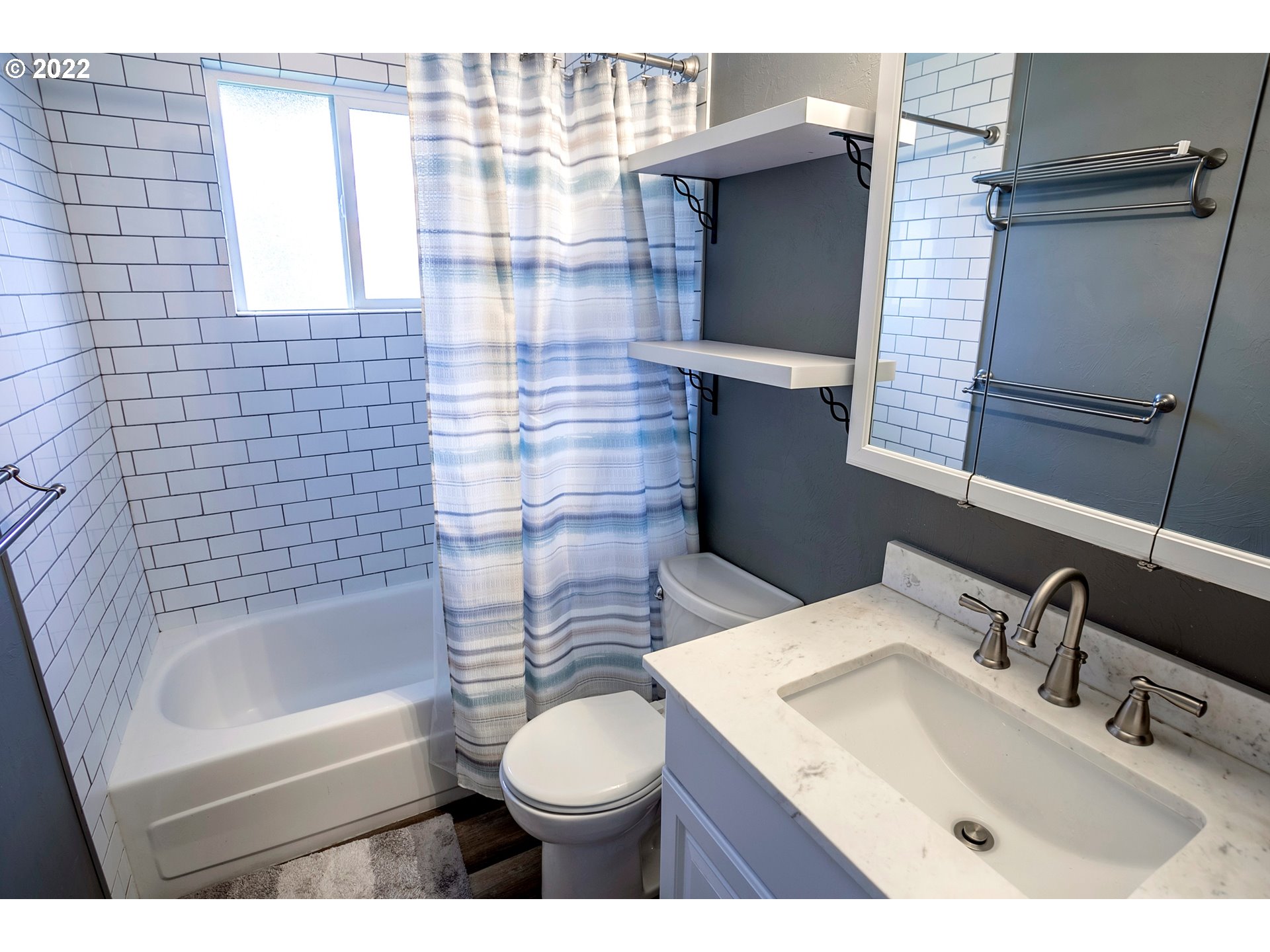 450 South 39th Place Springfield, OR 97478 - Photo 17 of 28 a bathroom with a sink toilet and shower
