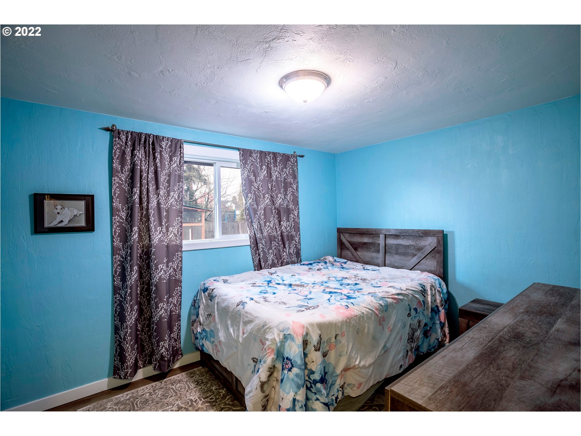 450 South 39th Place Springfield, OR 97478 - Photo 18 of 28 a bedroom with a bed and a window