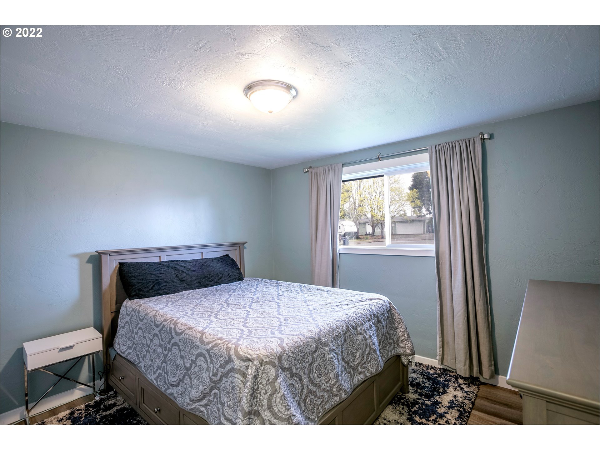 450 South 39th Place Springfield, OR 97478 - Photo 21 of 28 a bedroom with a bed and window