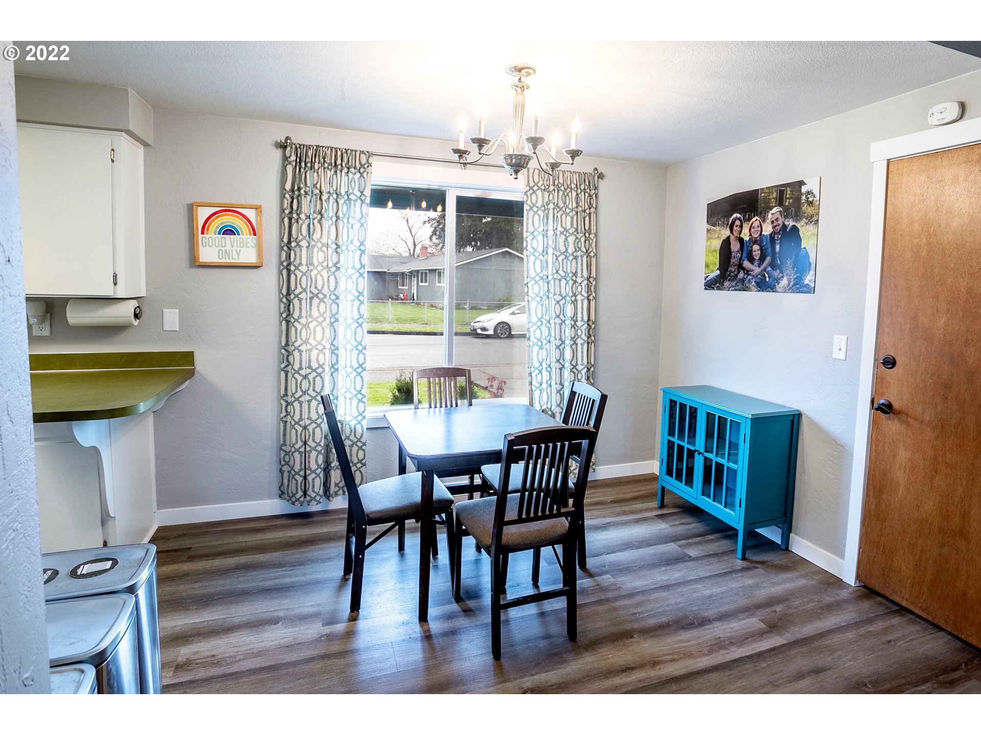 450 South 39th Place Springfield, OR 97478 - Photo 9 of 28 a view of a dining room with furniture and wooden floor